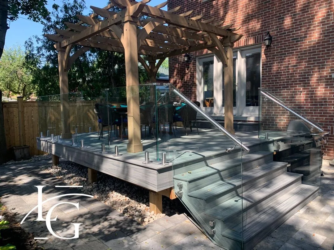 Spigot-mounted glass deck railing by pergola — Mississauga, GTA