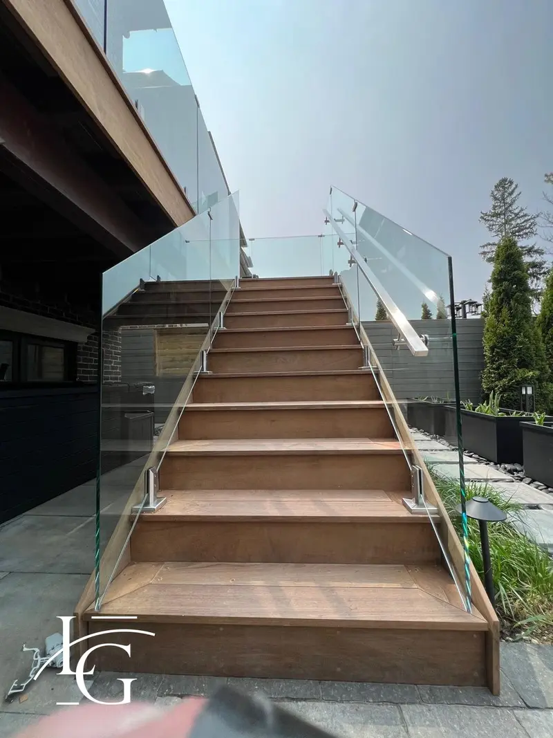 Wide exterior stair with frameless glass railing, 12 mm tempered — Toronto