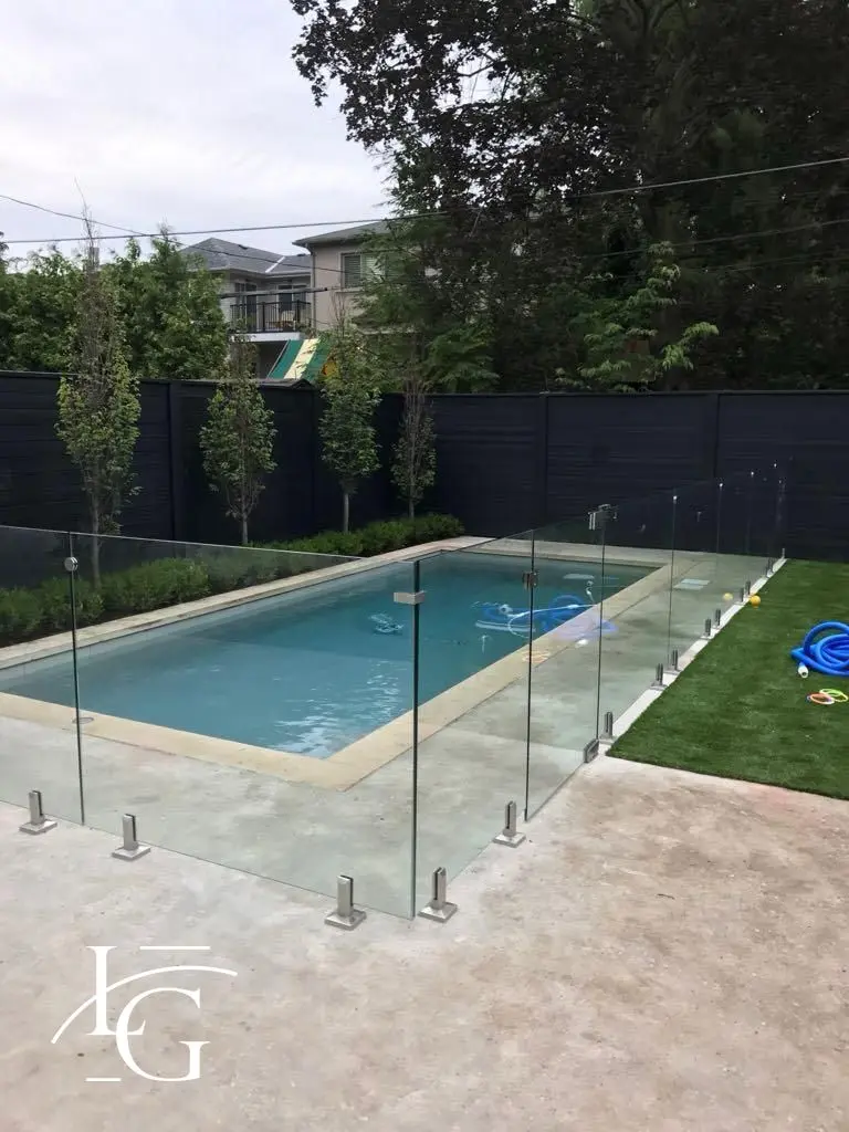 Frameless glass pool fence in a backyard, 12 mm tempered — Oakville