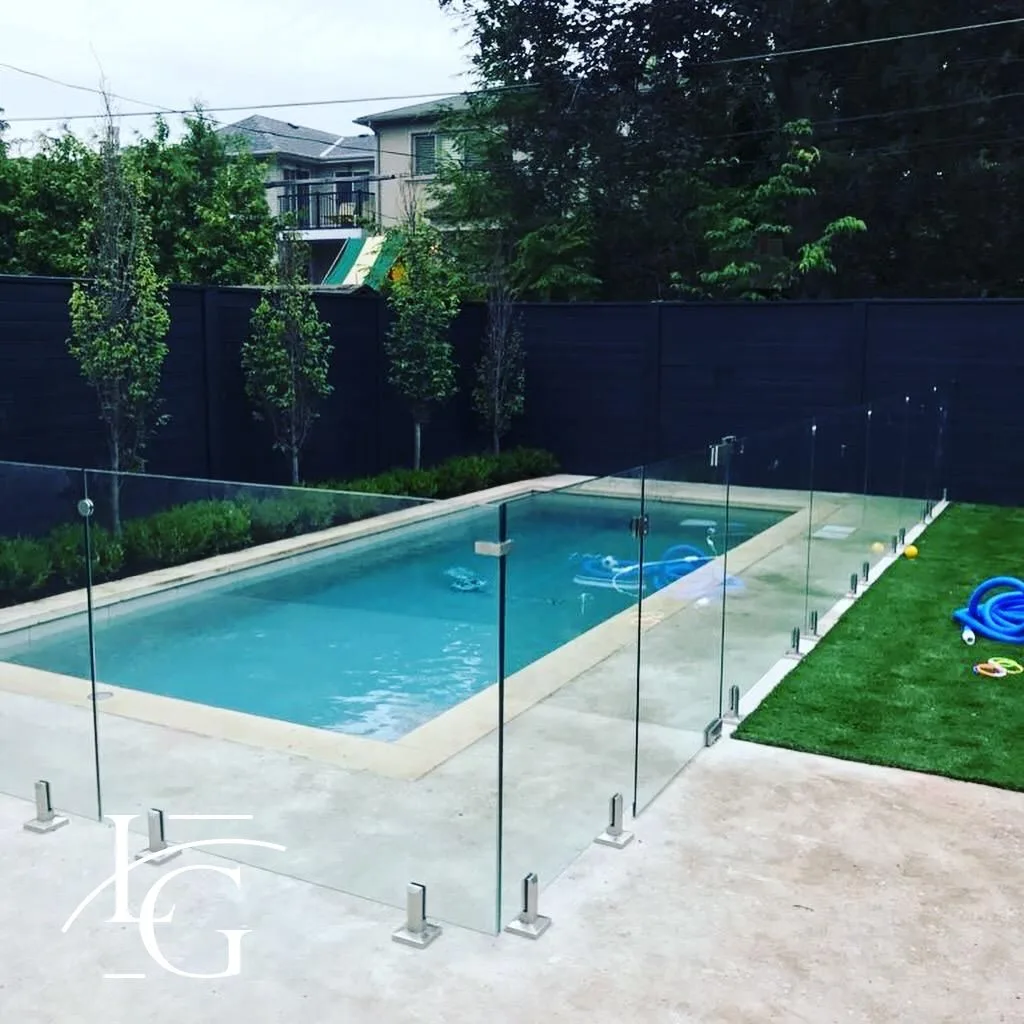 Tempered glass pool fence with Duplex 2205 spigots by Lux Glass, for Burlington backyards