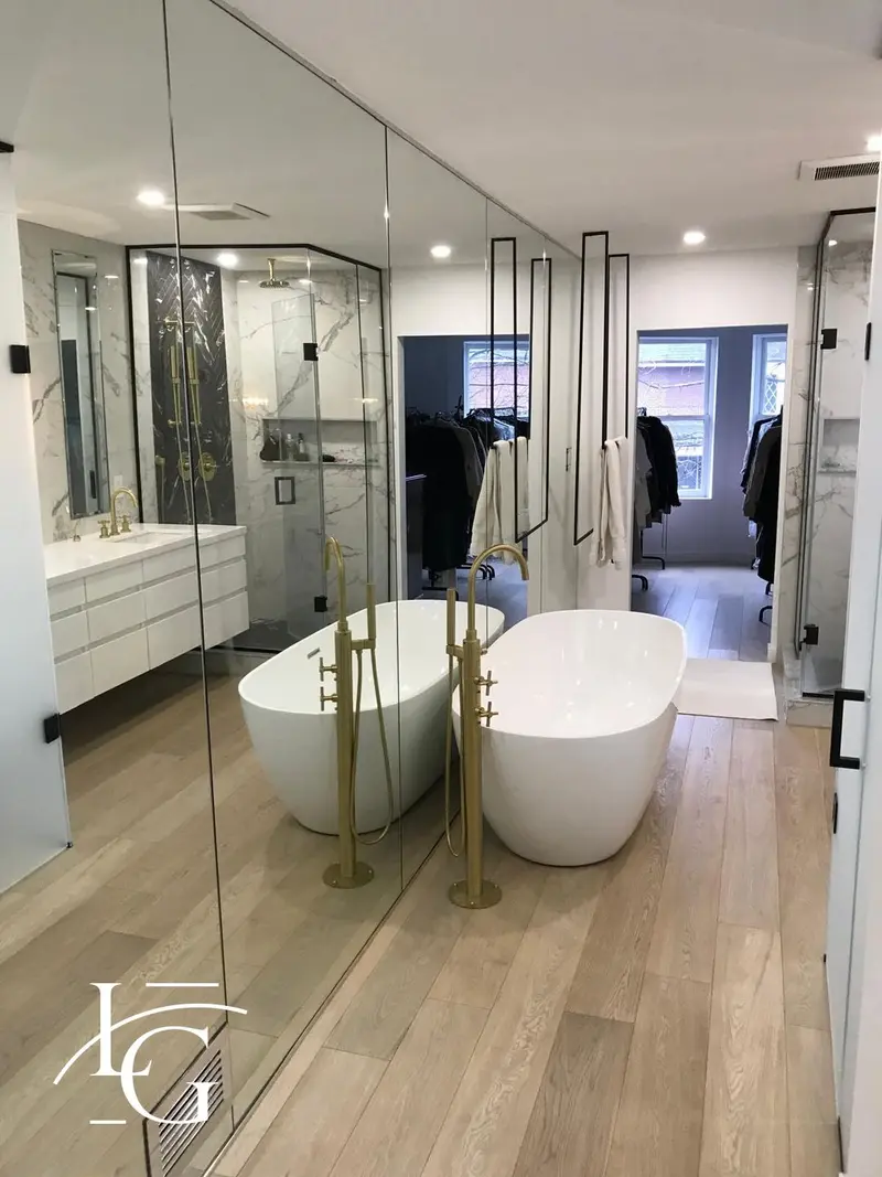 Full-height mirror walls in an ensuite bath