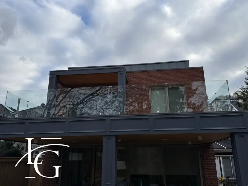 Modern home balcony with frameless glass railing