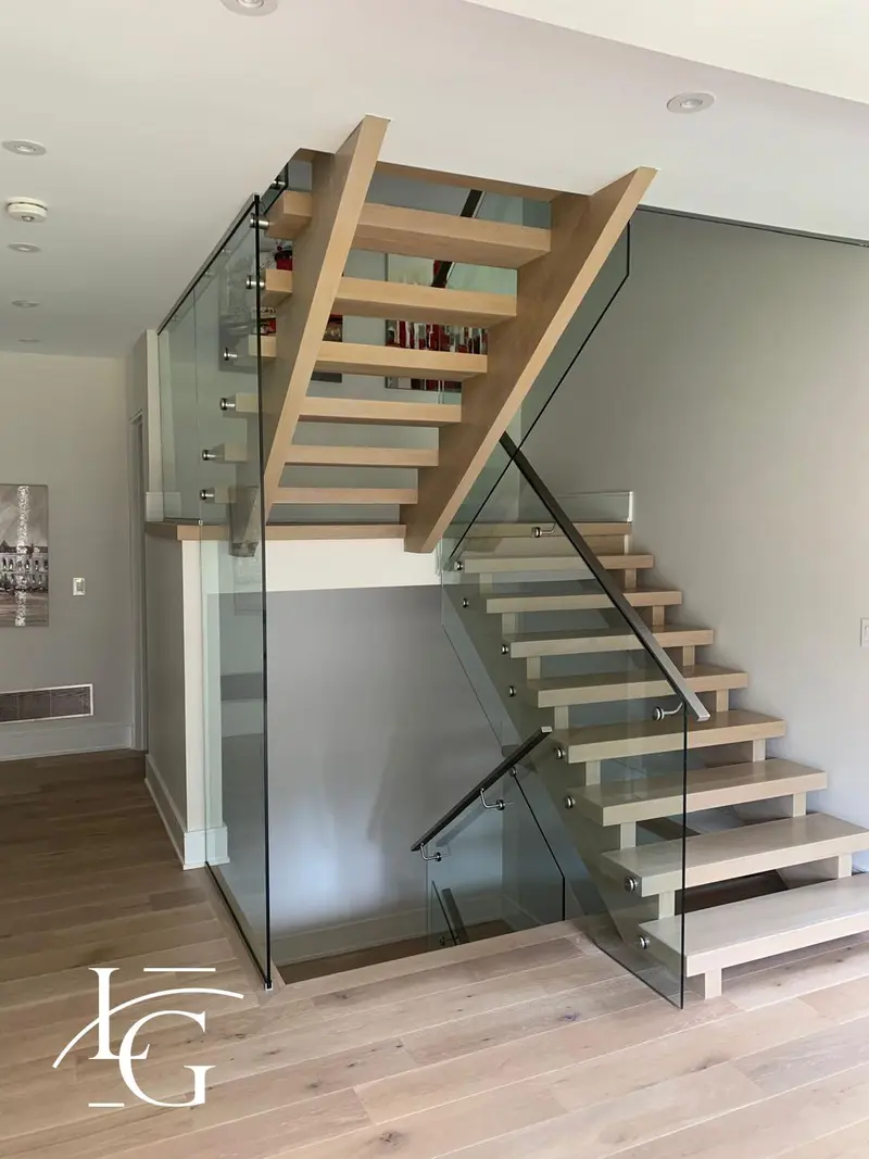 Open-riser white oak staircase with standoff glass railing