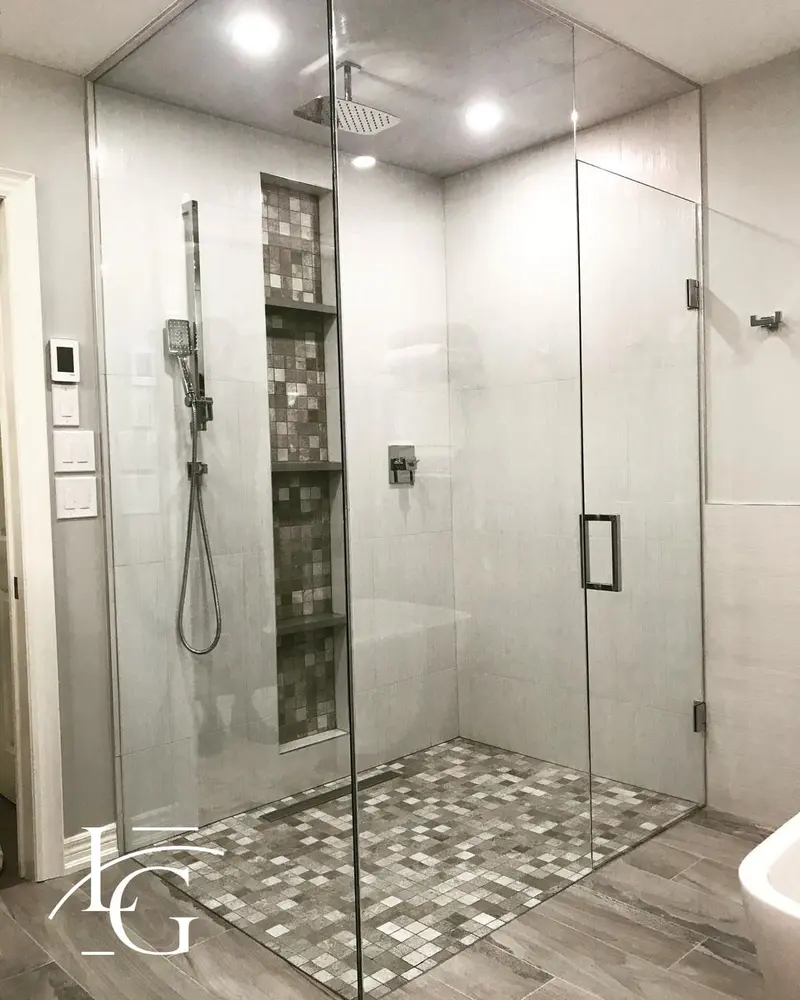 Frameless walk-in shower with mosaic tile