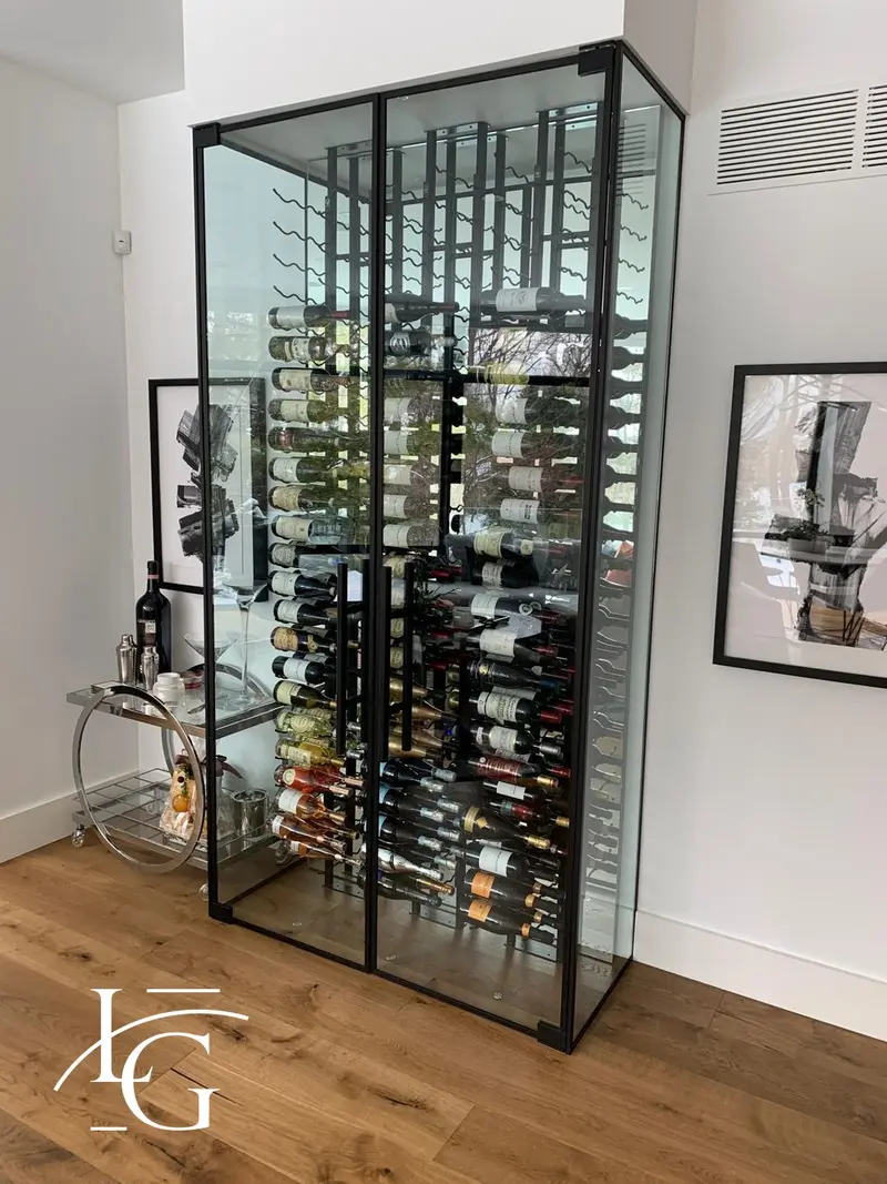 Glass-enclosed wine cellar with black frame