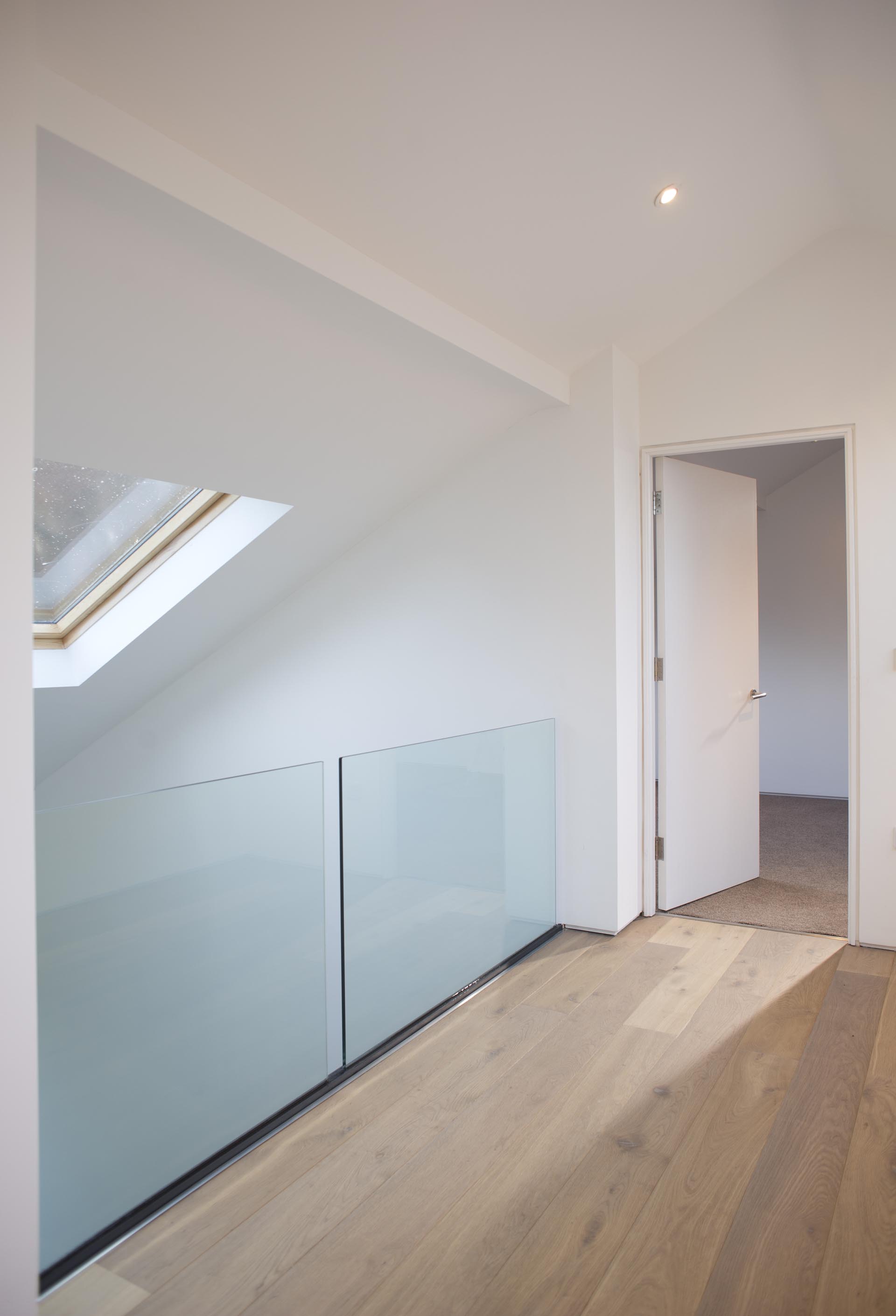 Interior shoe-system glass railing — Burlington home