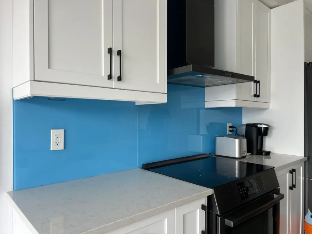 Blue back-painted glass backsplash installed in a Toronto kitchen by Lux Glass