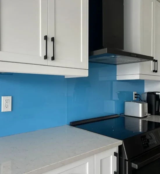 Blue back-painted glass backsplash installed in a Toronto kitchen by Lux Glass