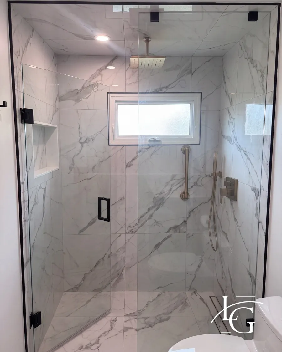 Frameless shower installed by Lux Glass in Etobicoke, matte black hardware