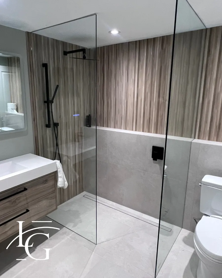 Frameless shower installed by Lux Glass in Etobicoke, matte black hardware