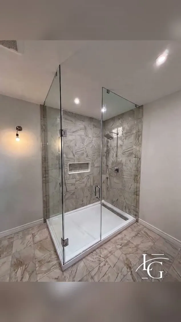 Frameless shower installed by Lux Glass in Hamilton, chrome hardware