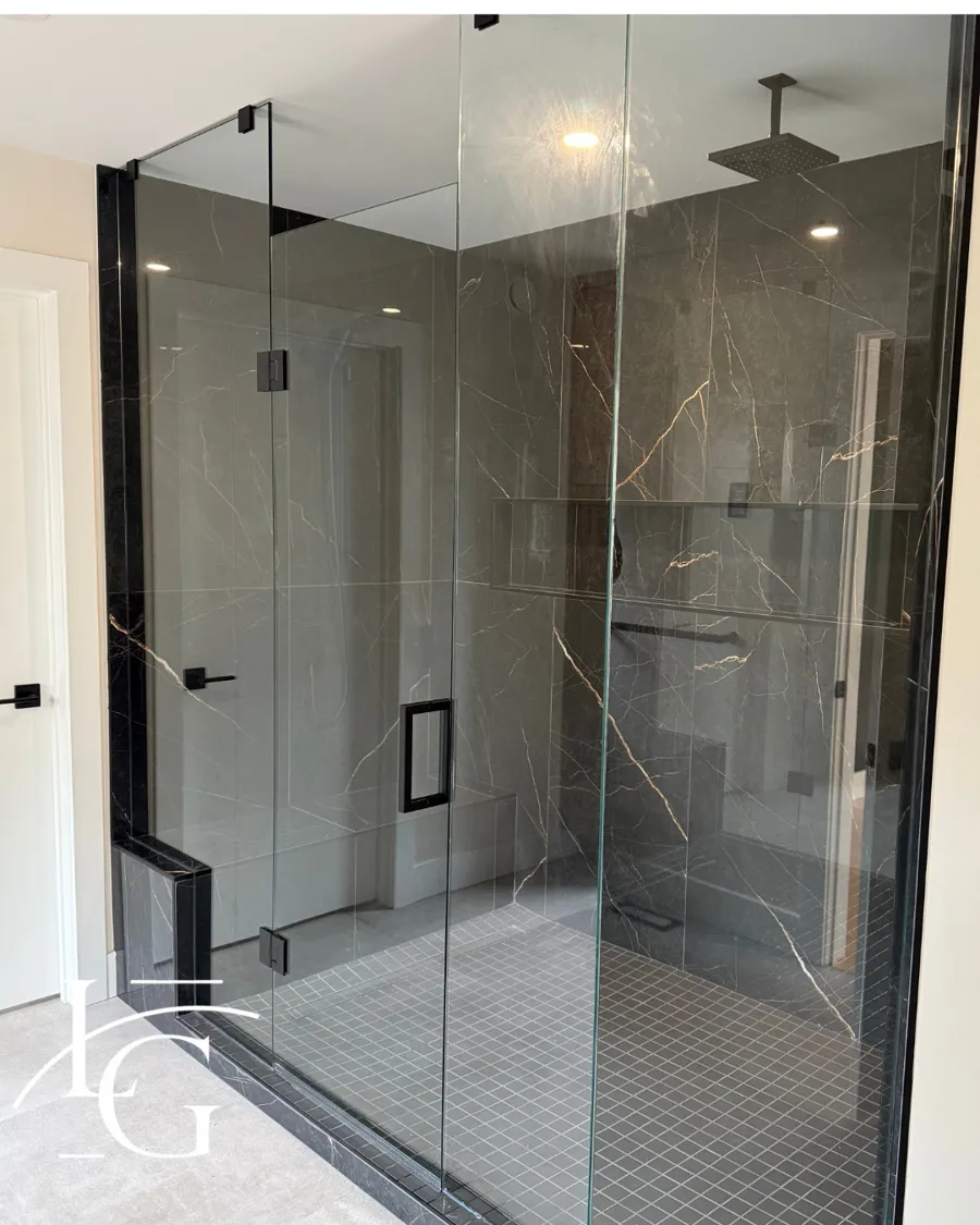 Frameless shower installed by Lux Glass in Kitchener, matte black hardware