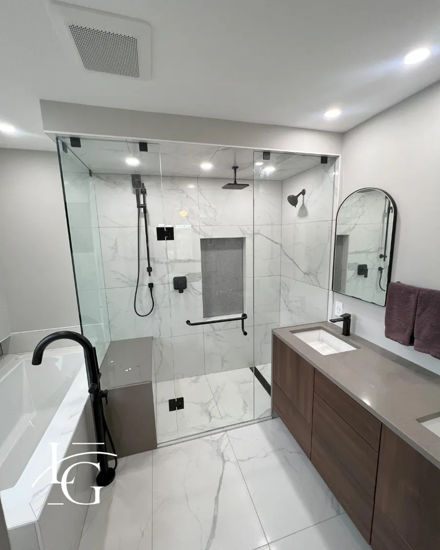 Frameless shower installed by Lux Glass in Burlington, matte black hardware