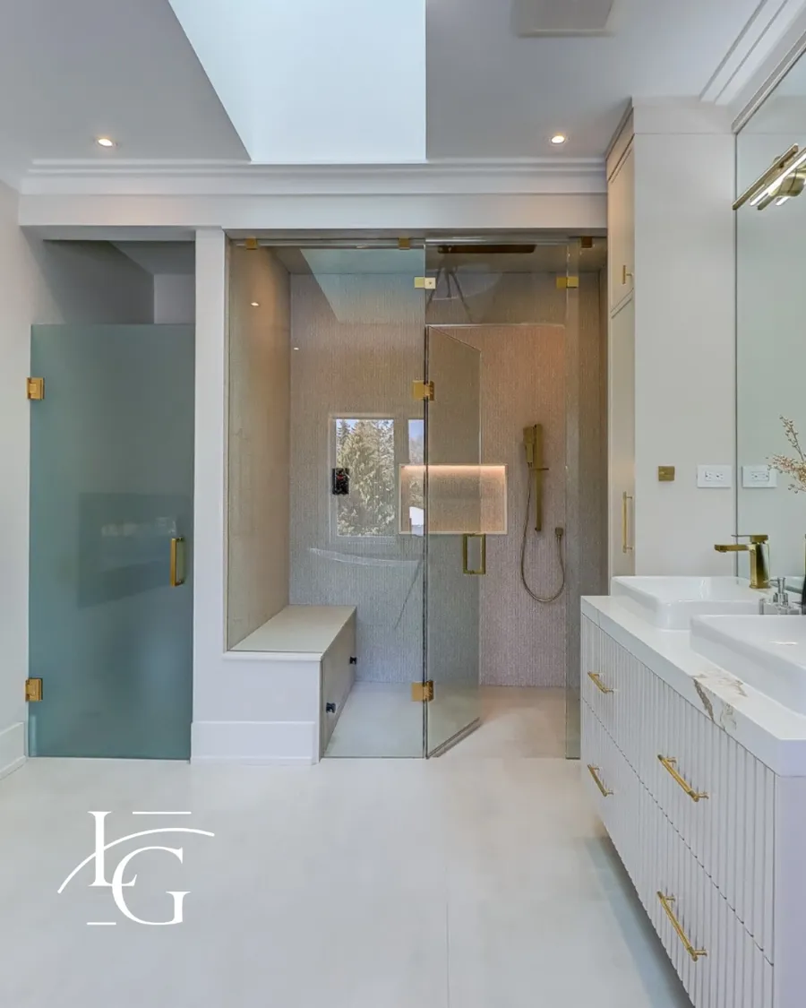 Frameless shower installed by Lux Glass in Mississauga, brass and gold hardware