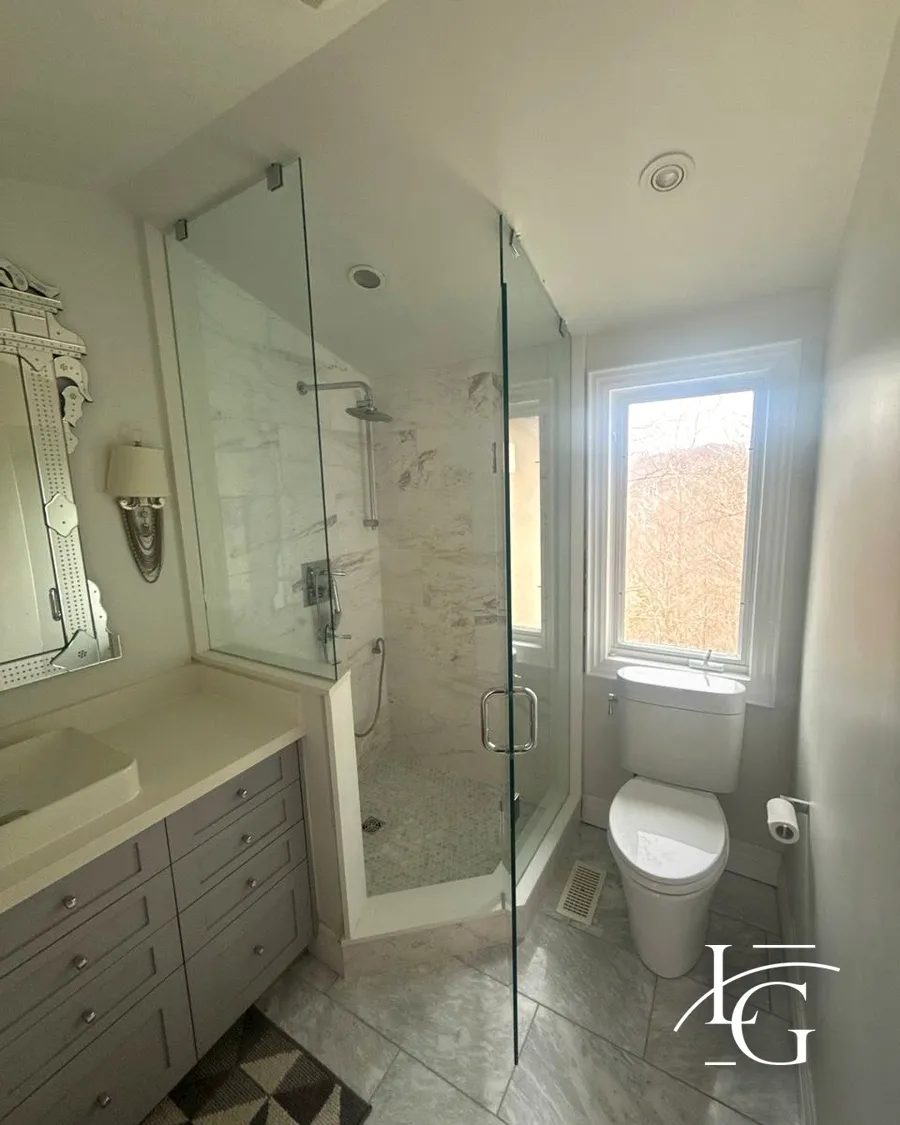 Frameless shower installed by Lux Glass in Toronto, chrome hardware, neo-angle