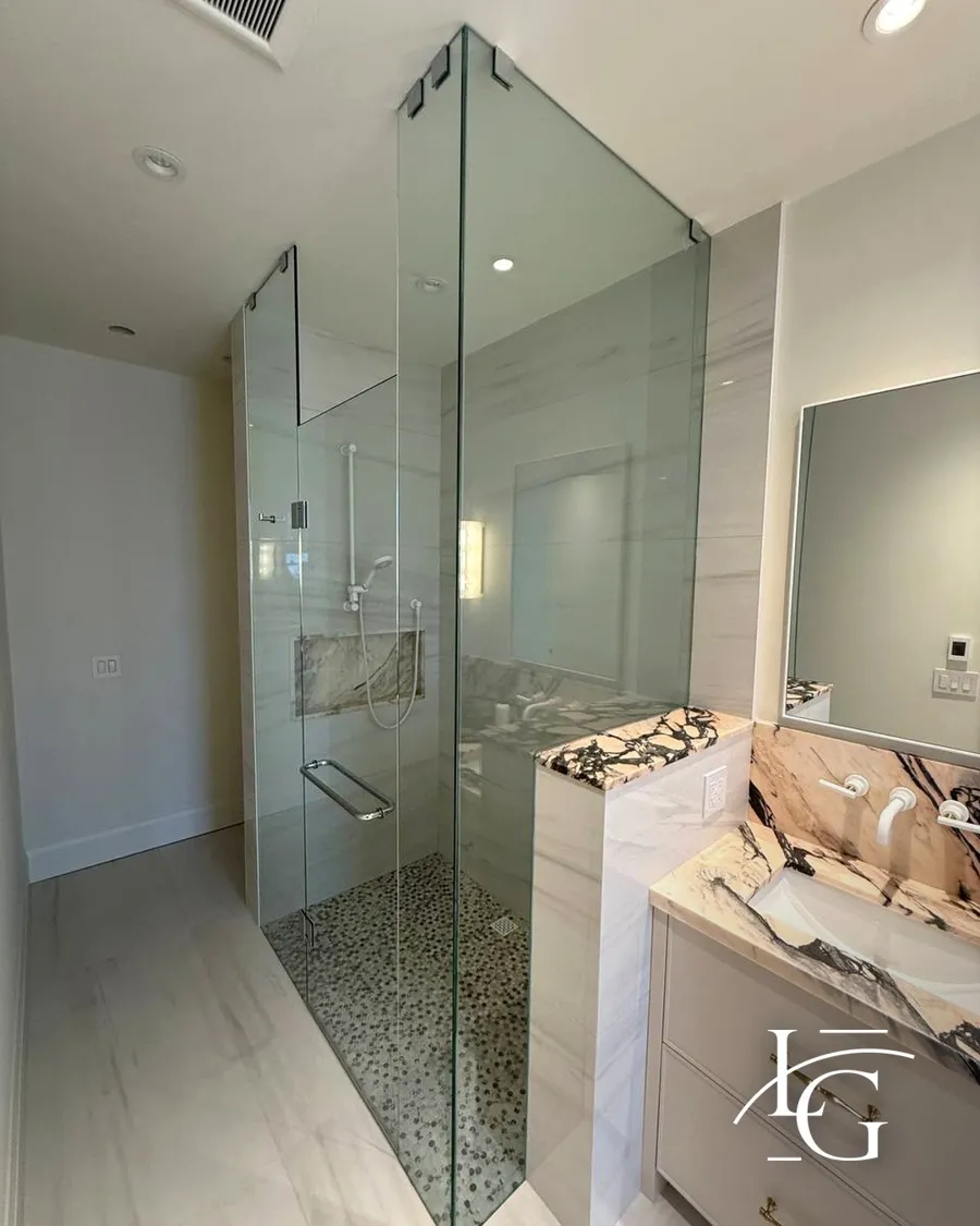 Frameless shower installed by Lux Glass in Toronto, chrome hardware