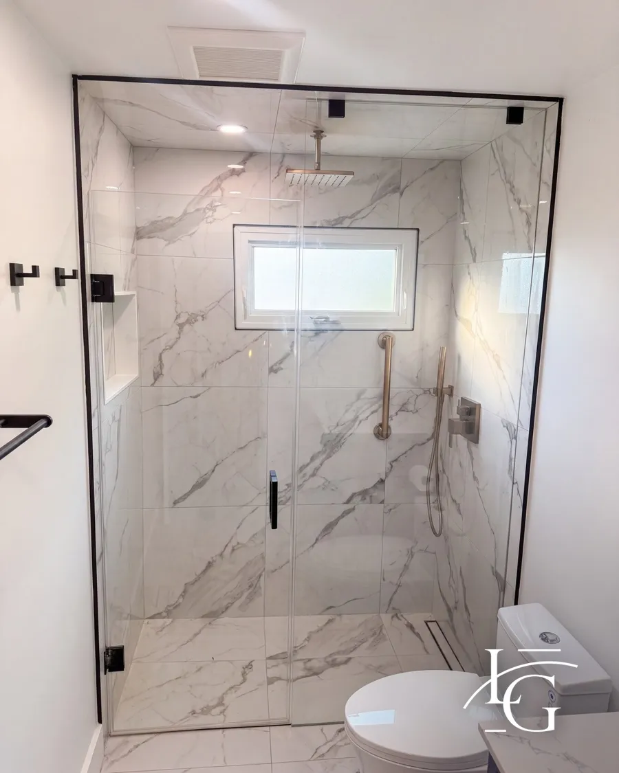 Frameless shower installed by Lux Glass in Vaughan, matte black hardware