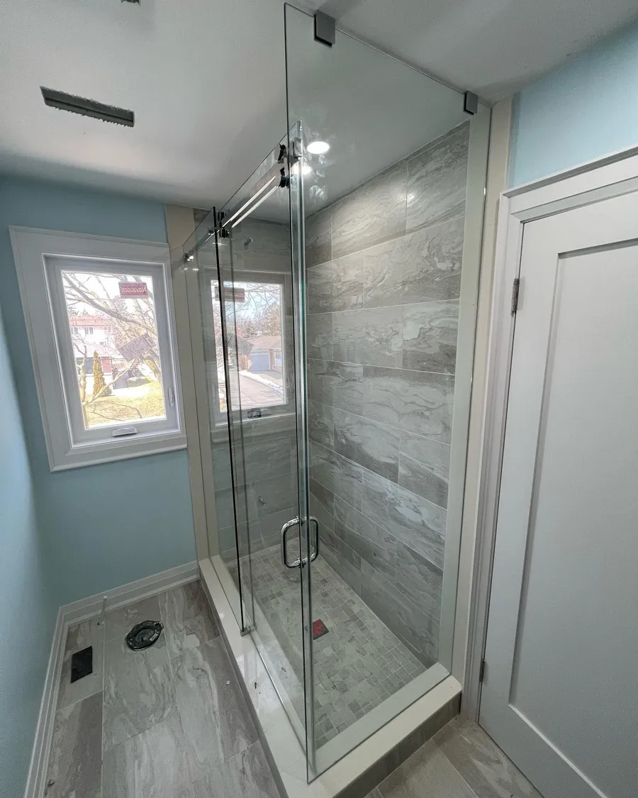 Frameless shower installed by Lux Glass in Waterloo, sliding door
