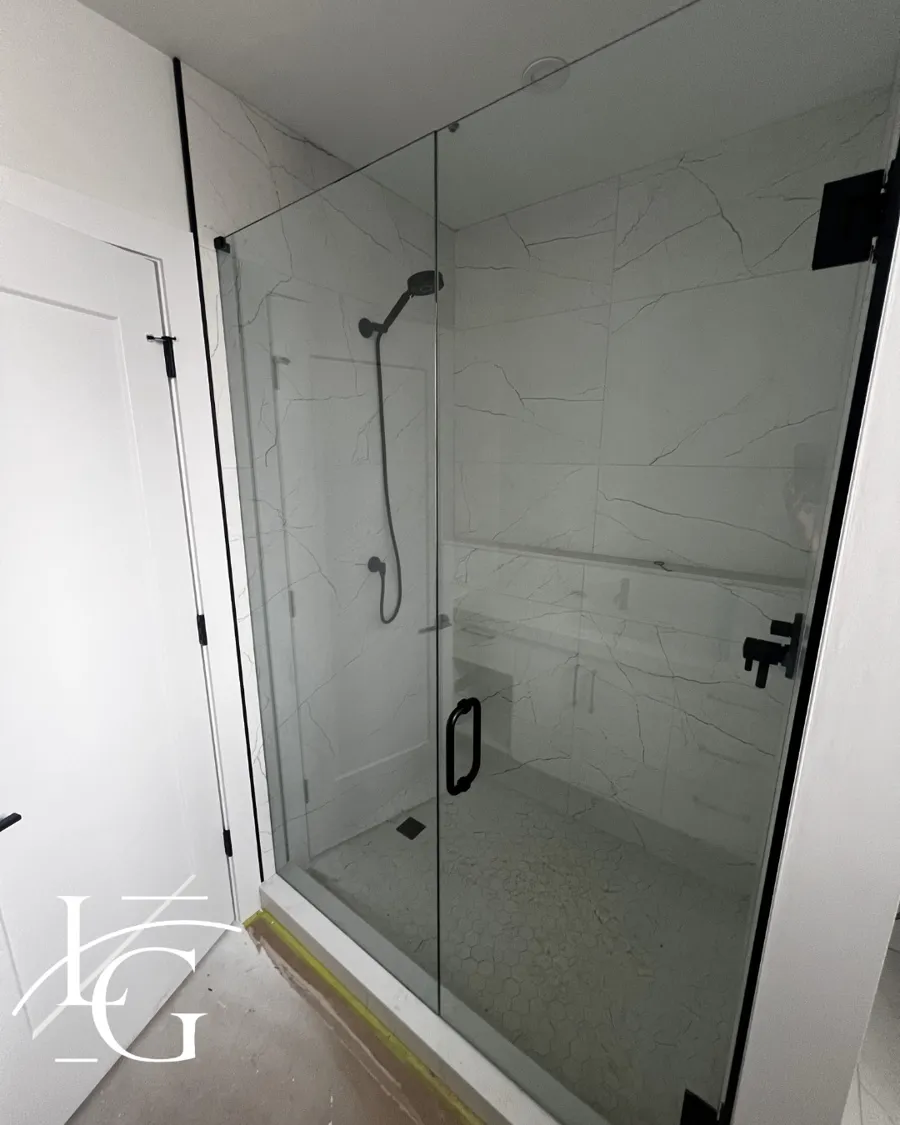 Frameless shower installed by Lux Glass in Woodbridge, matte black hardware