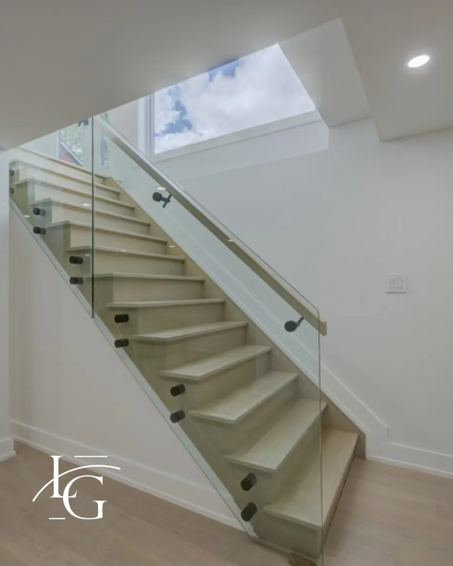 Glass railing installed by Lux Glass in Hamilton, matte black hardware, stair